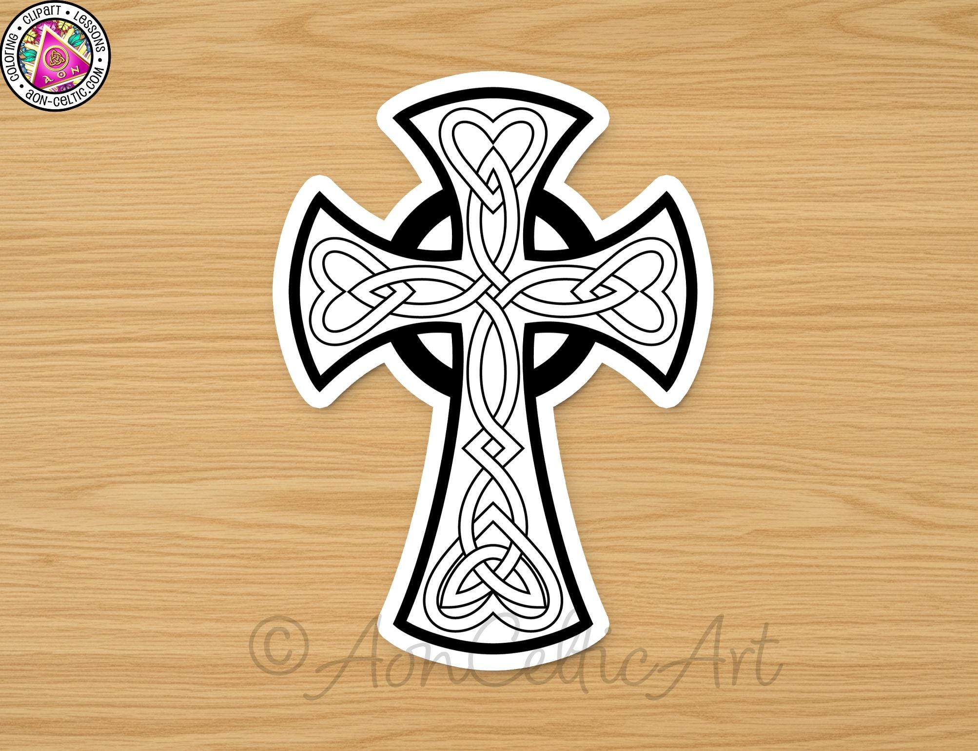 A sticker depicting a black and white cross design with intricate Celtic knot patterns.