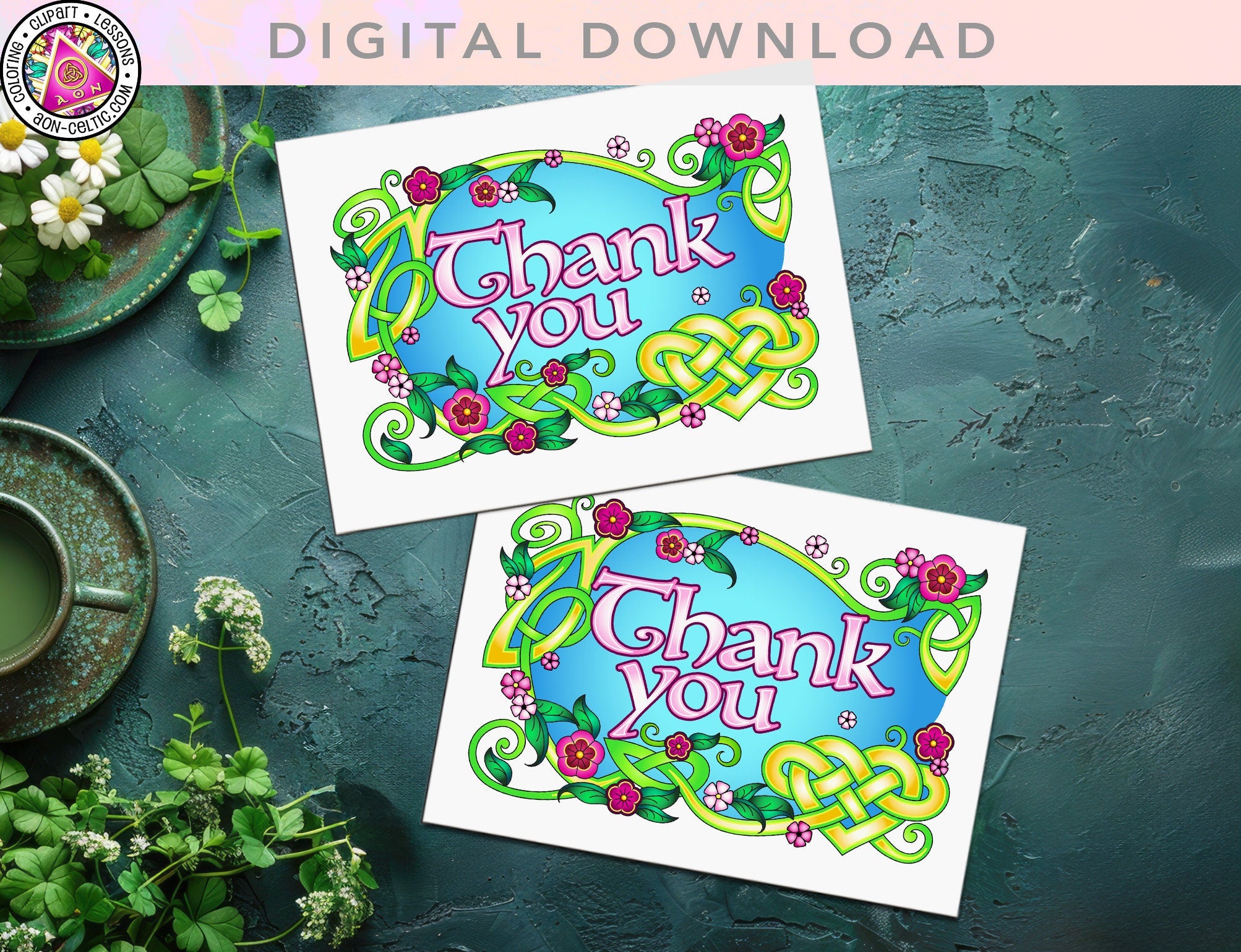 two thank you cards sitting on top of a table