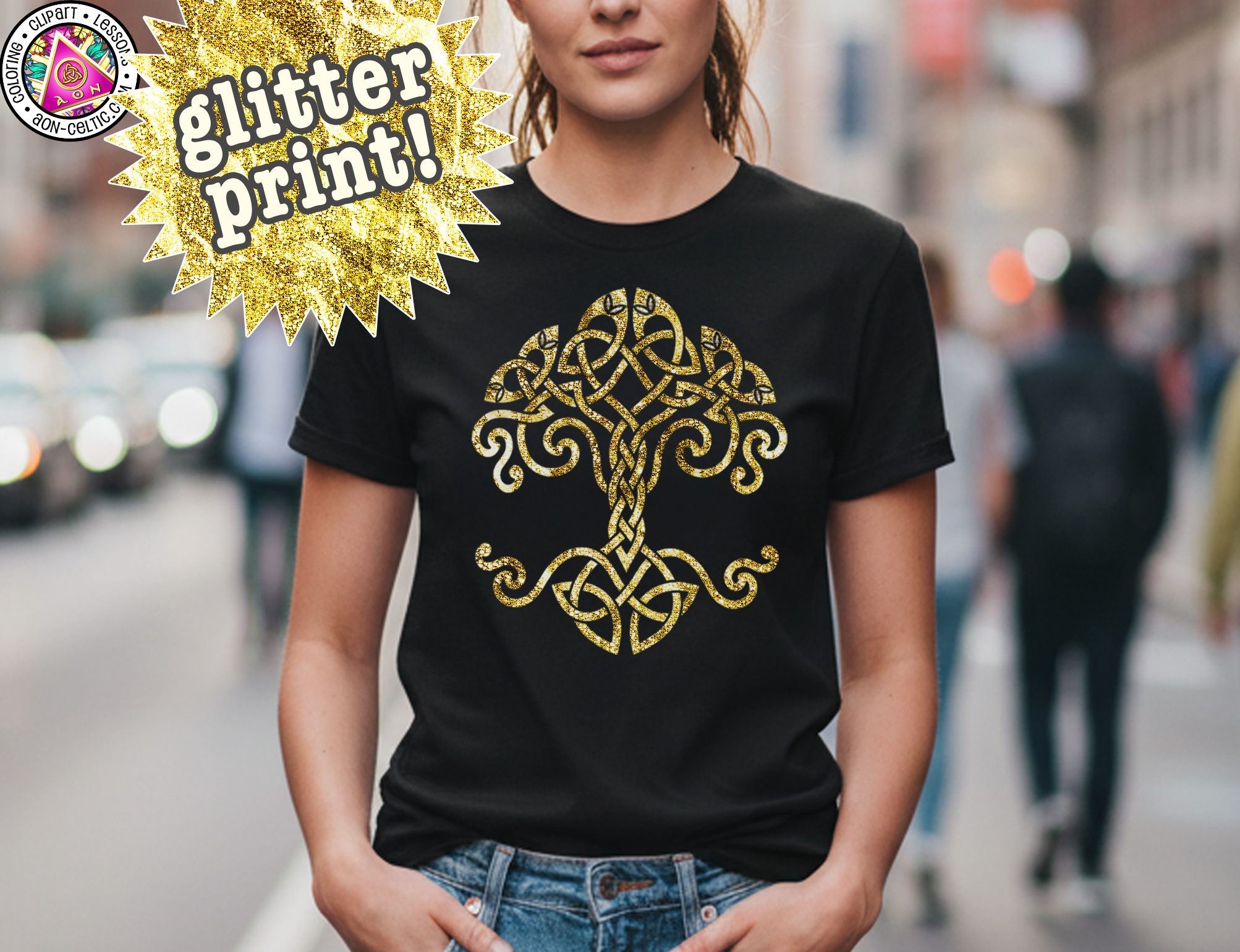 A woman wearing a black t-shirt with a gold tree design printed on it, standing on a city street.