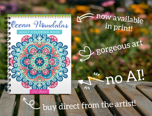 The image is an advertisement for an adult coloring book called "Ocean Mandalas" featuring a spiral-bound notebook with a colorful mandala design. The book is now available in print, and it is described as a gorgeous art piece. The text emphasizes that the book is not a robot and can be bought directly from the artist.
