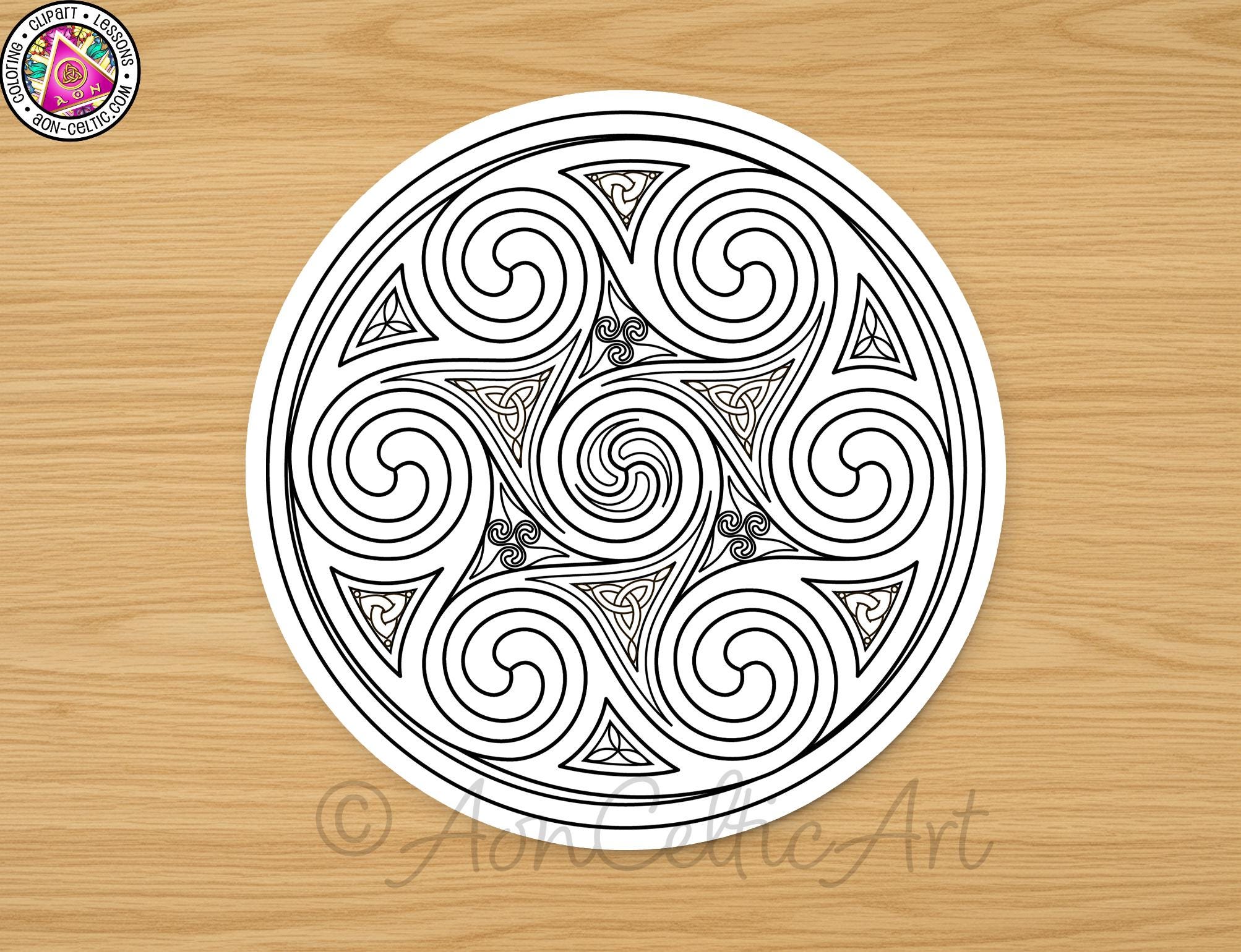 a circular design with intricate spiral patterns and symbols, including triangles and swirls, all set against a wooden background.