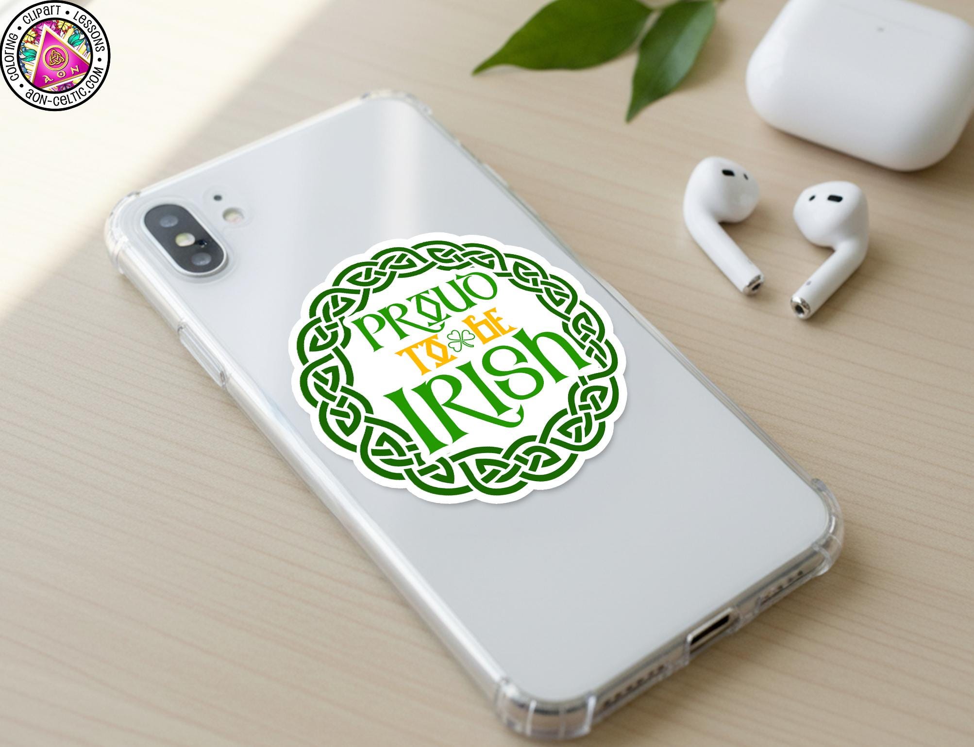 a smartphone with a sticker on the back displaying the text "Proud to be Irish" in a circular design.