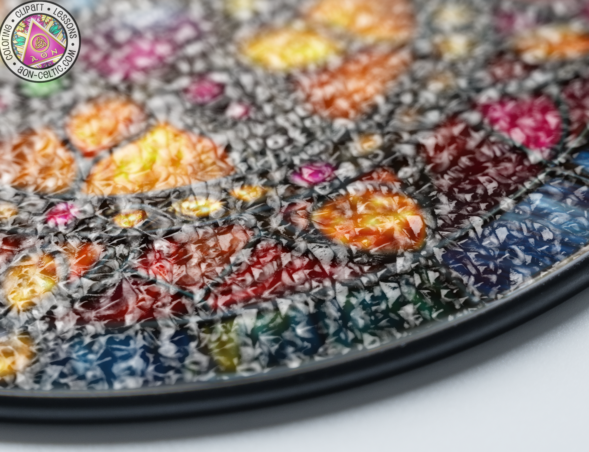 a close up of a multicolored plate on a table