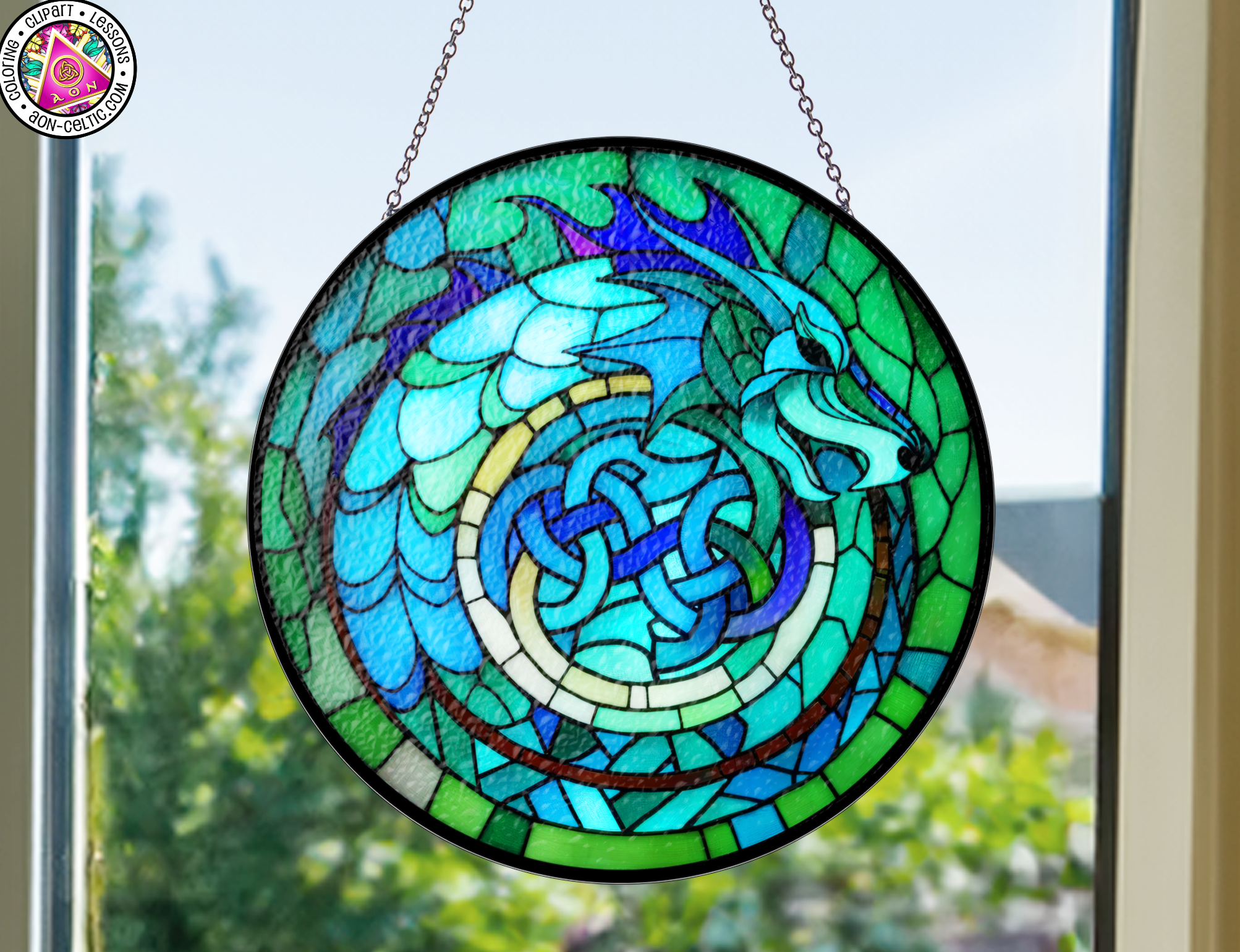 a circular stained glass window hanging from a chain