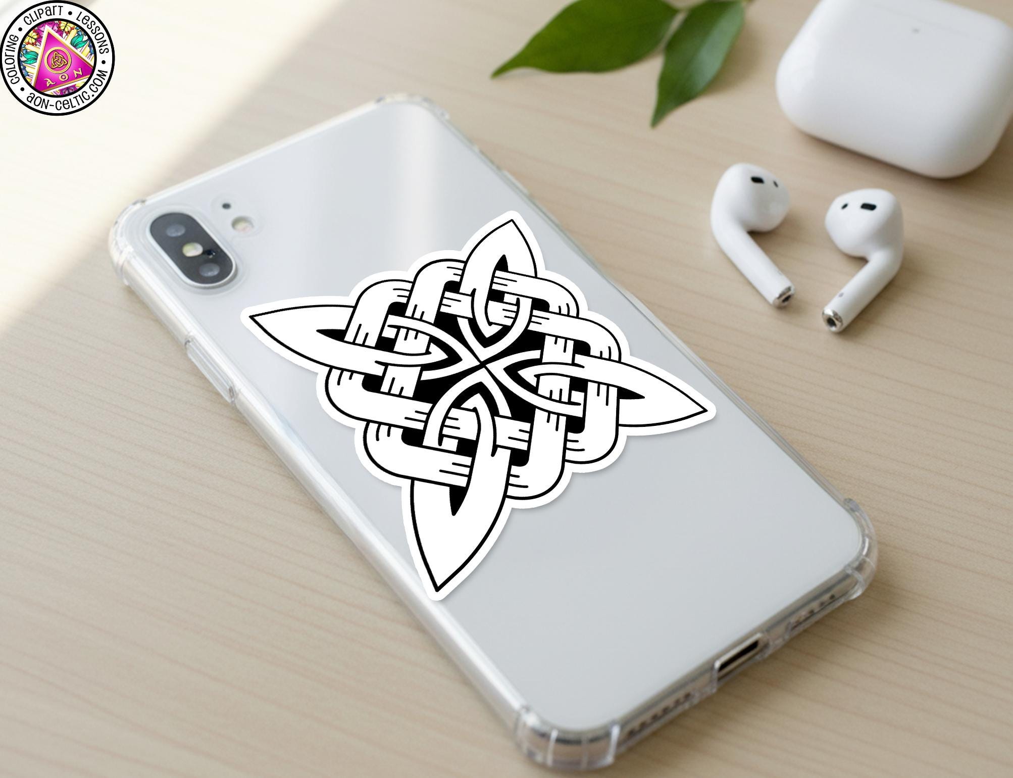 a smartphone with a sticker of a Celtic knot design on its back cover, along with a pair of white earbuds and a white phone case.