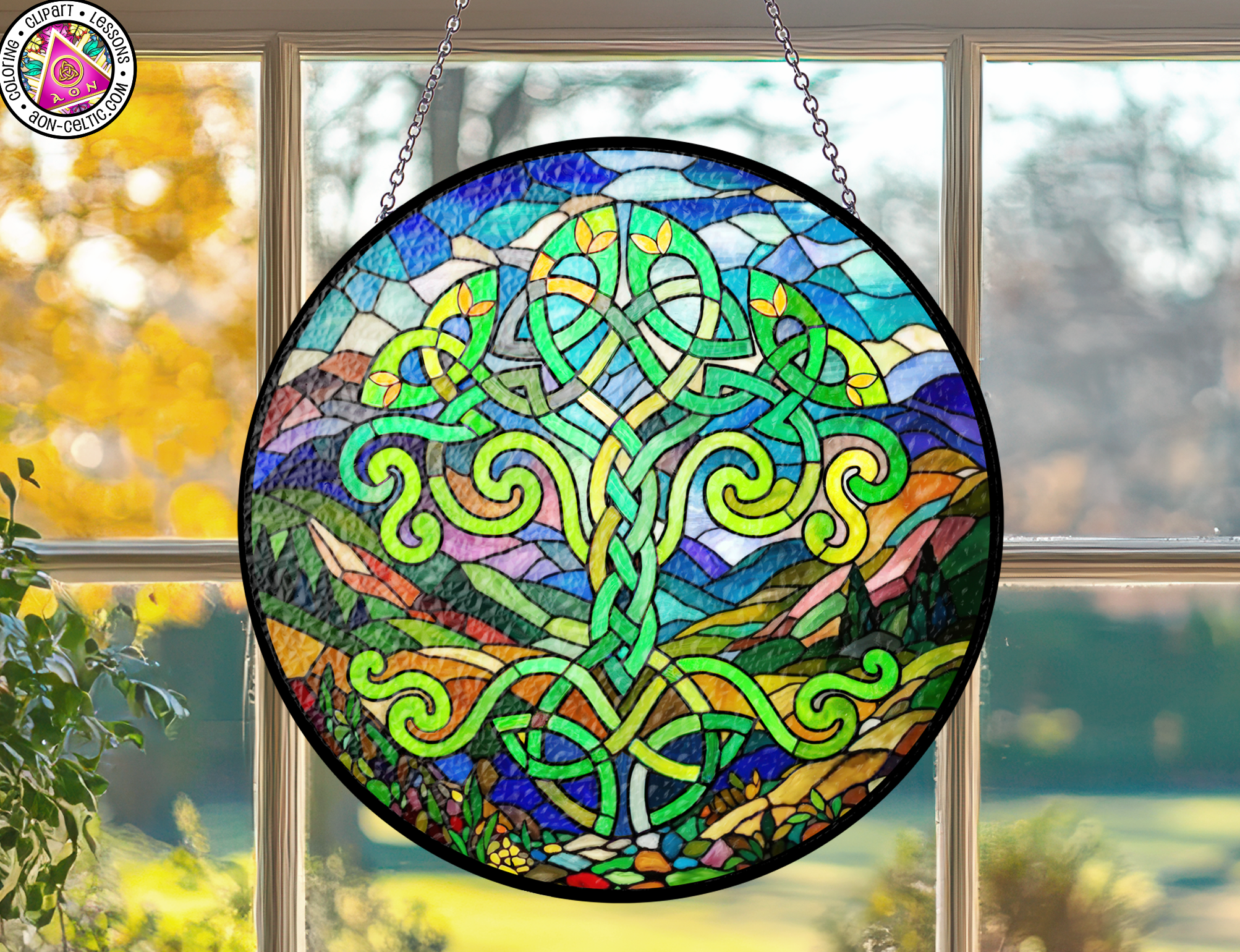 a stained glass sun catcher hanging from a window