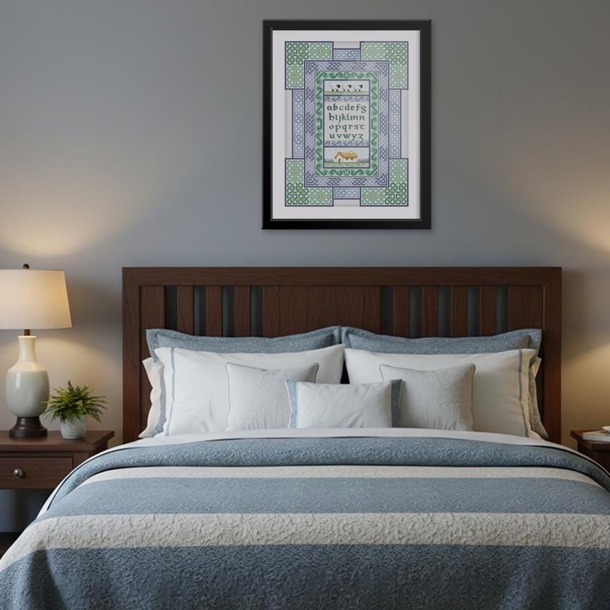a bedroom with a large bed, a wooden headboard, and a framed print hanging above it. The bed is covered in a blue and white striped comforter and has several pillows. The framed print is a decorative piece with a geometric pattern and text.