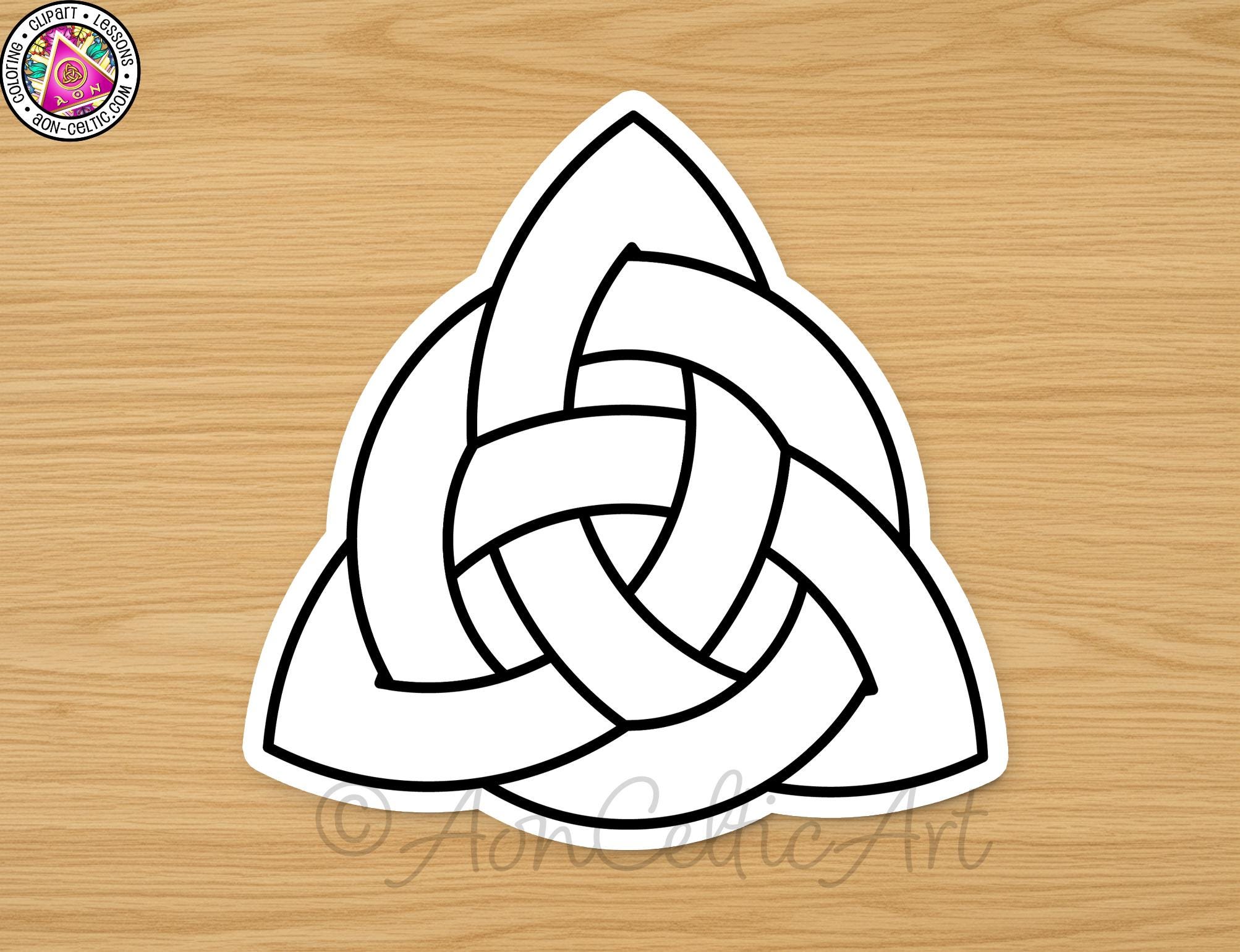 A white triangle with a knot-like pattern inside it, placed on a wooden surface.