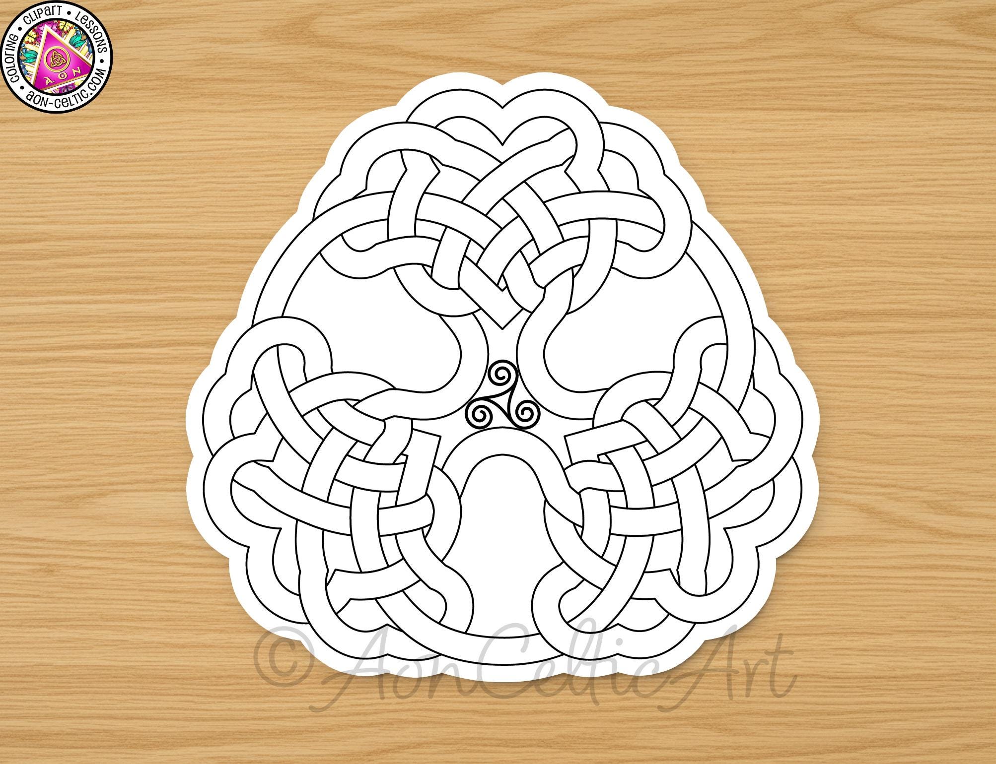 A black and white image of a Celtic knot design on a wooden surface.