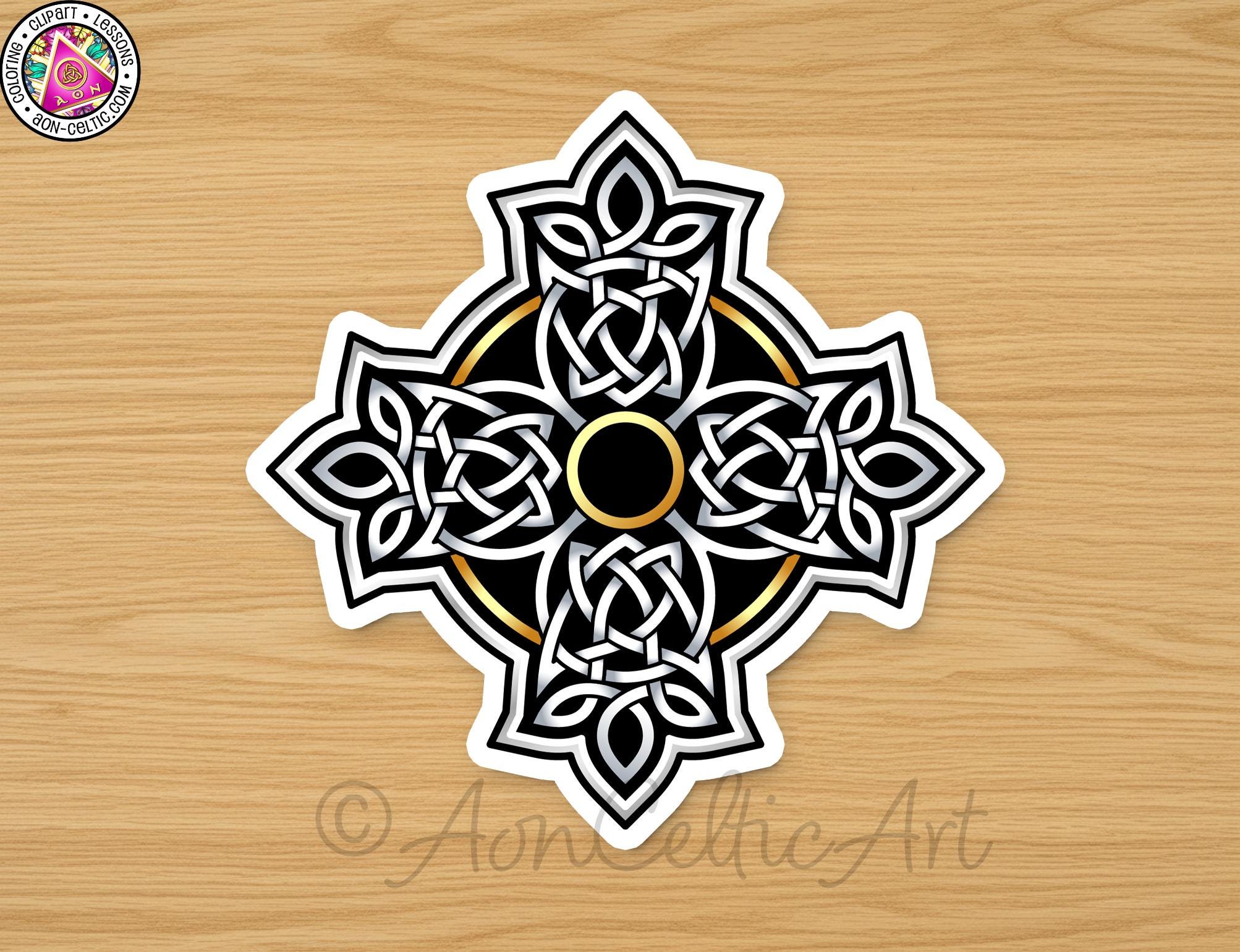 A decorative Celtic cross design with intricate patterns and a central black circle.