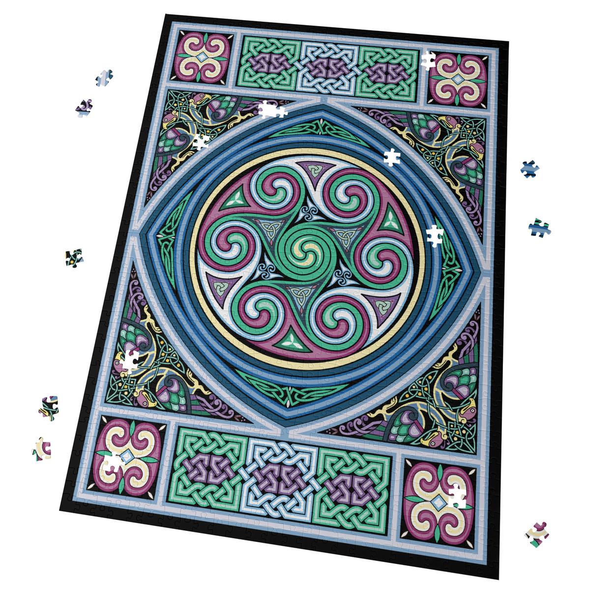 a large, intricate, and colorful Celtic-inspired design with swirling patterns and shapes in shades of blue, green, purple, and pink. The design is surrounded by scattered puzzle pieces, suggesting that it is a completed puzzle.