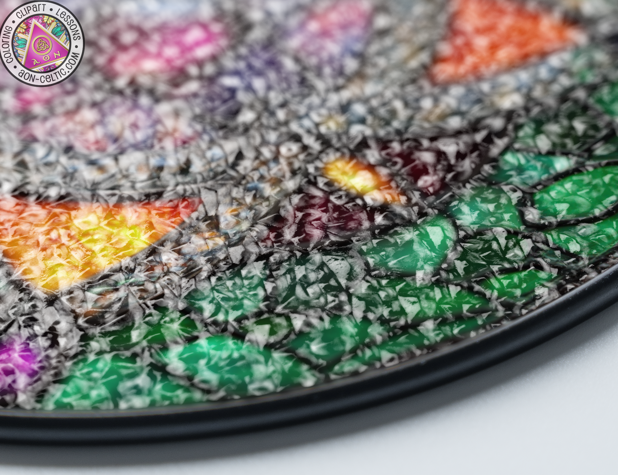 a close up of a plate with a colorful design on it