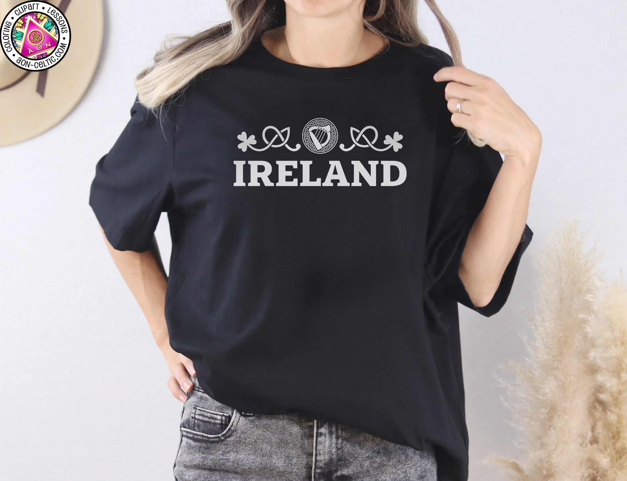 a woman wearing a black shirt that says ireland