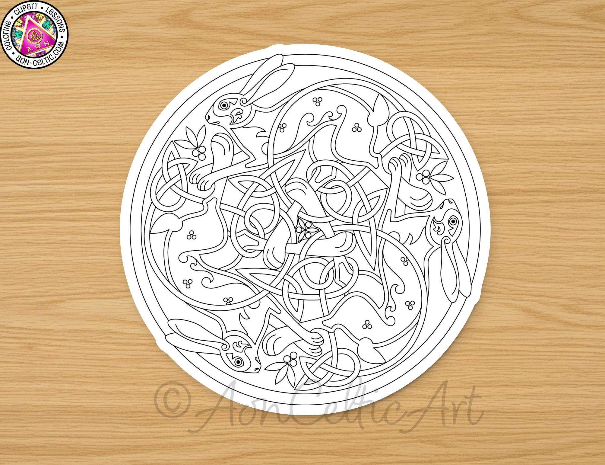 A circular design featuring intricate Celtic knot patterns and various animal figures, including rabbits and deer, on a wooden surface.