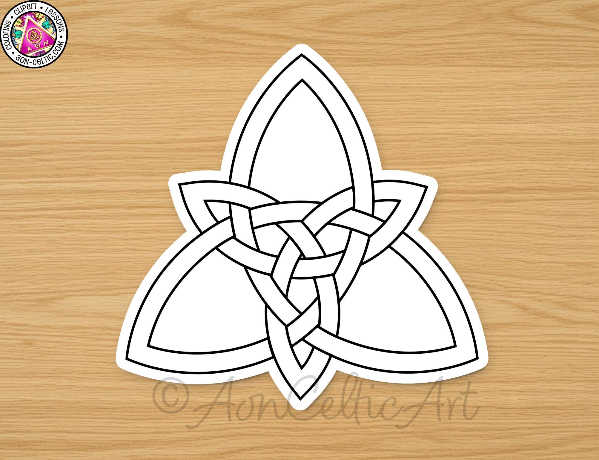 A white sticker with a black outline of a Celtic knot design on a wooden surface.