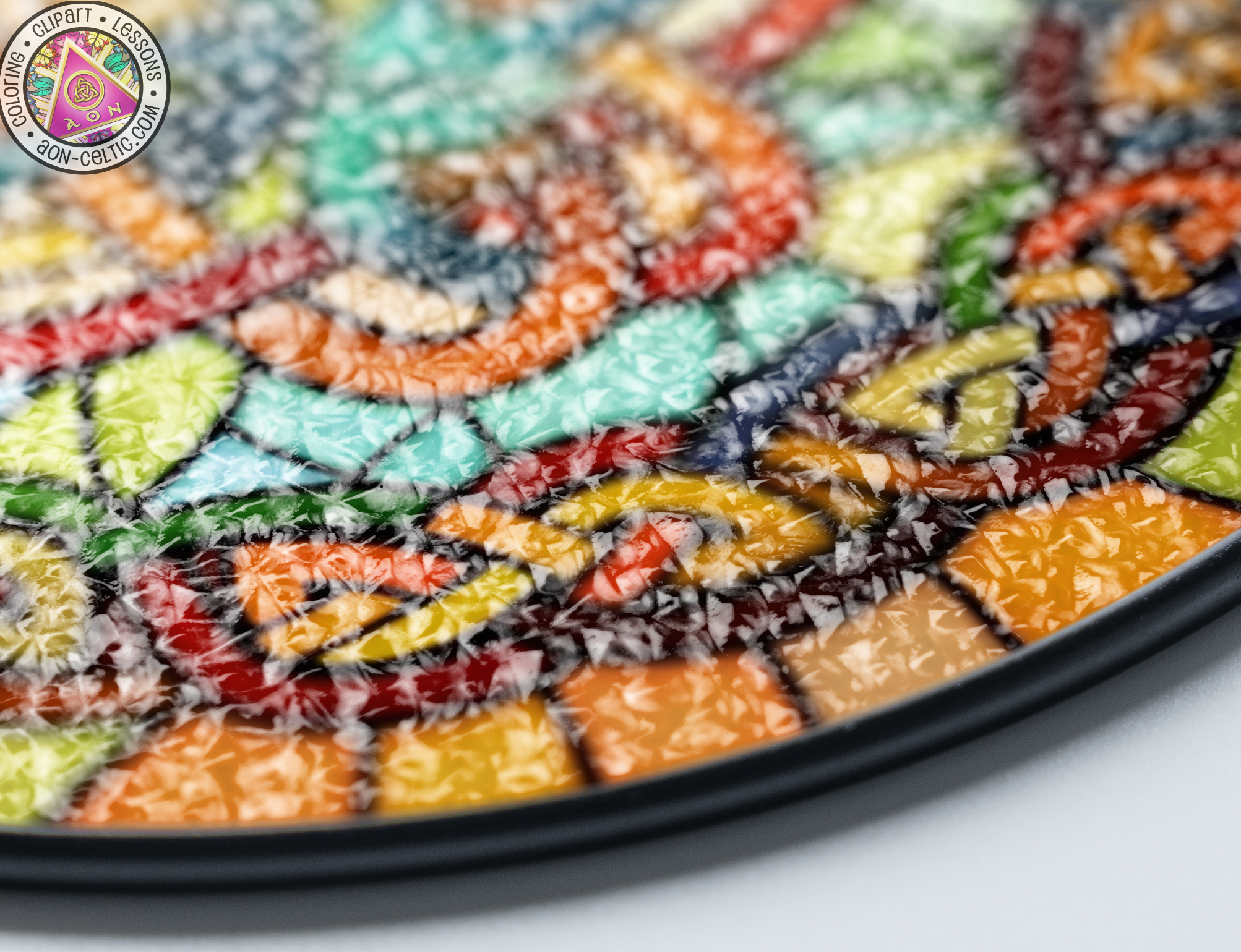 a close up of a multicolored plate on a table
