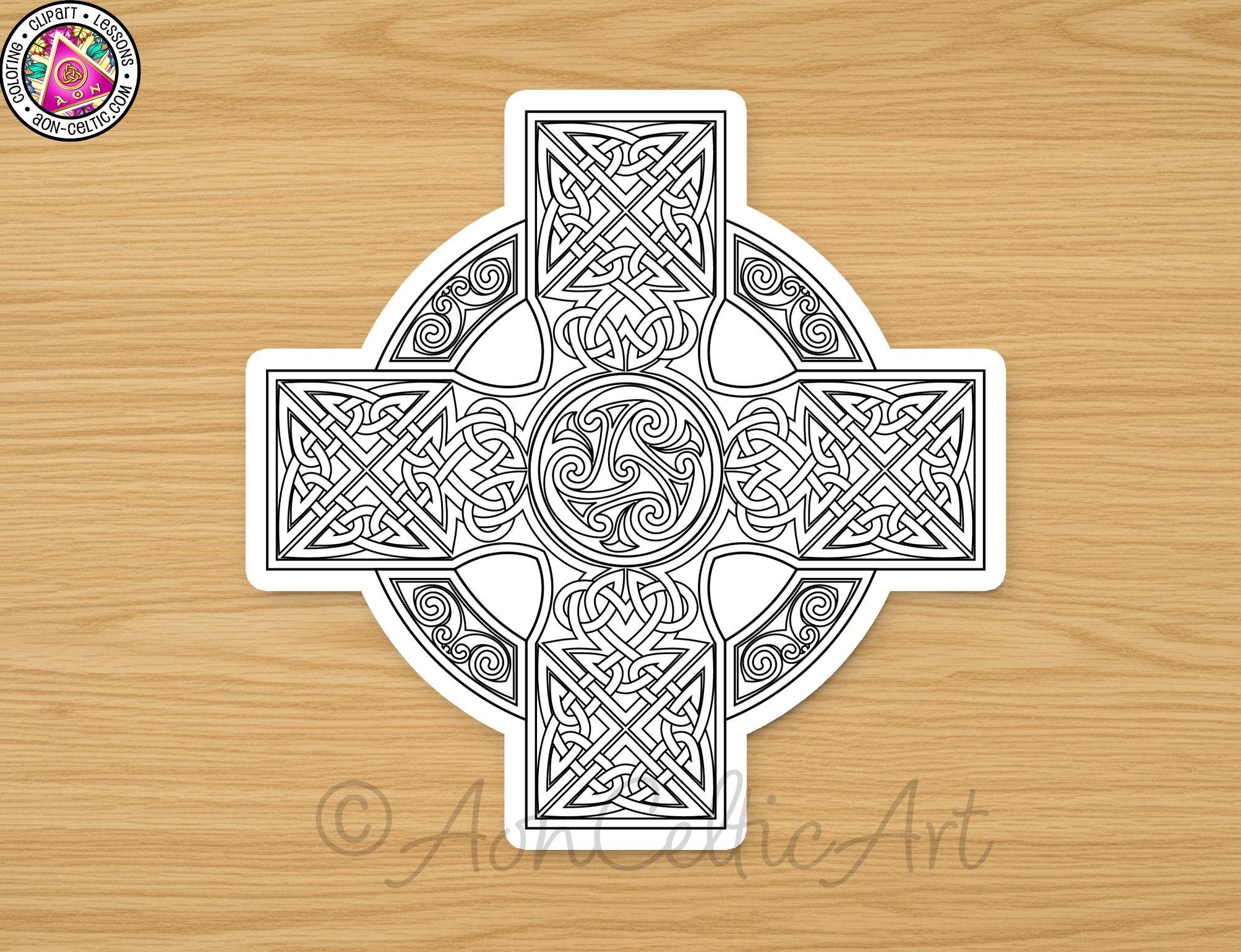 A detailed black and white illustration of a Celtic cross design on a wooden surface.