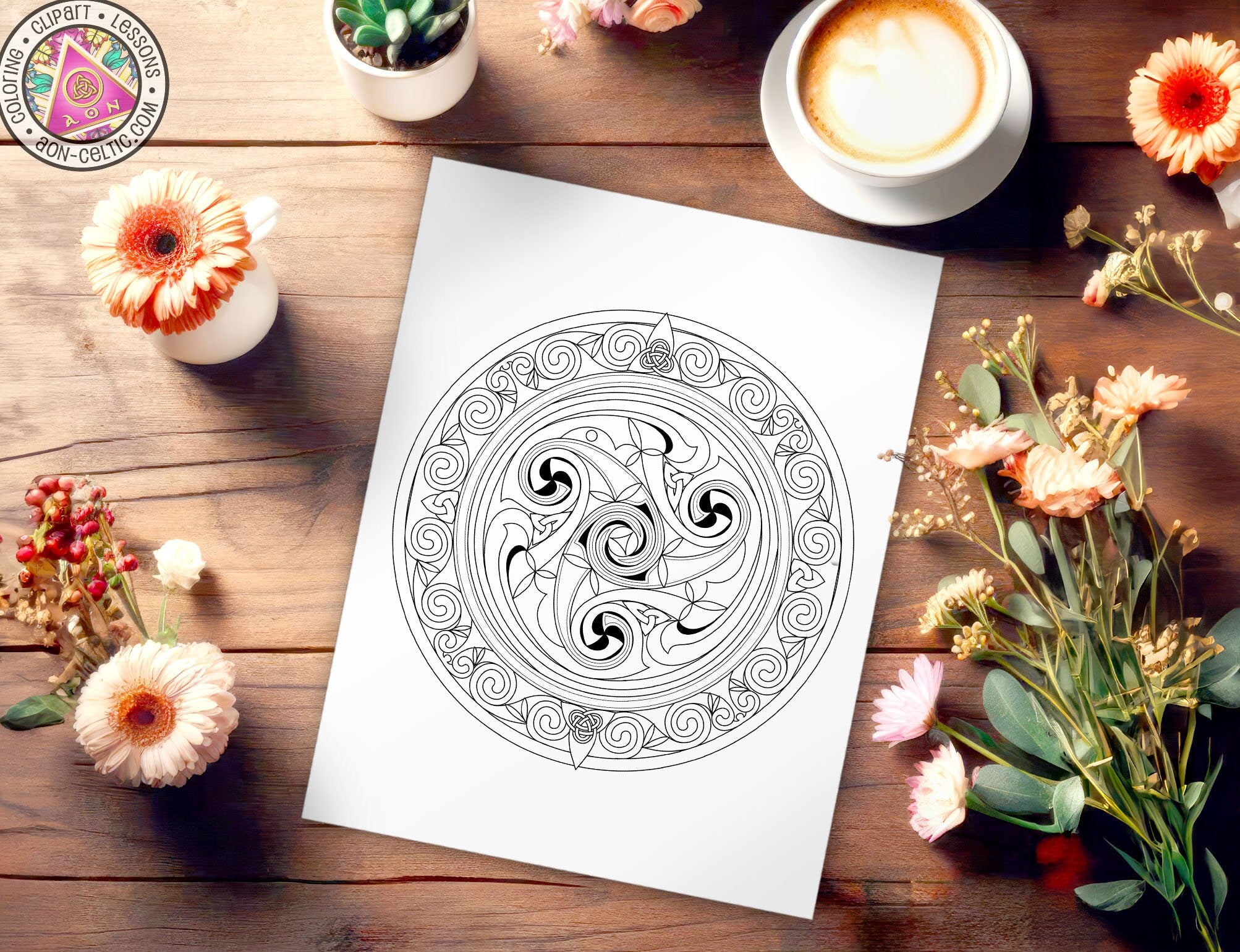 a picture of a coffee cup and some flowers on a table