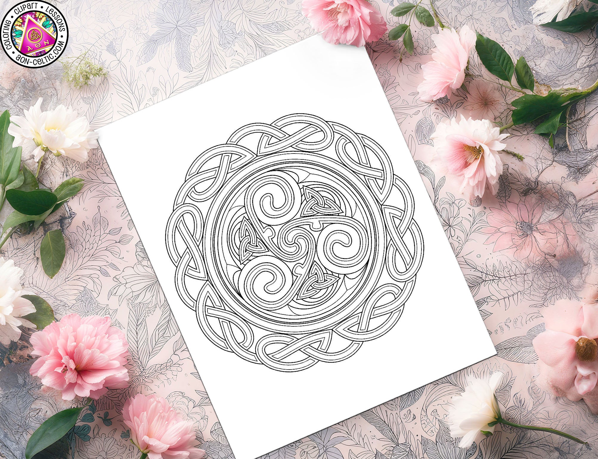 a paper with a design on it next to flowers and a cup of coffee