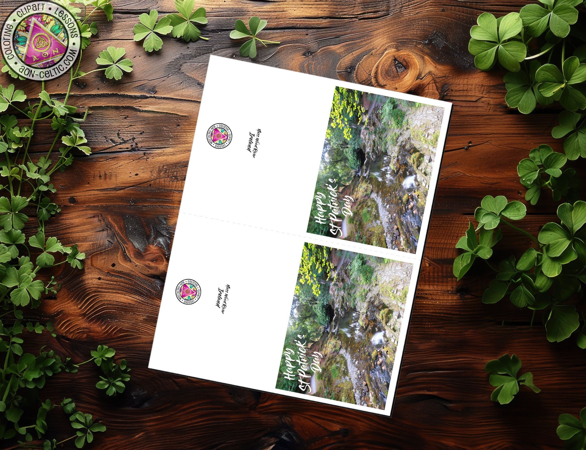 two envelopes sitting on top of a wooden table