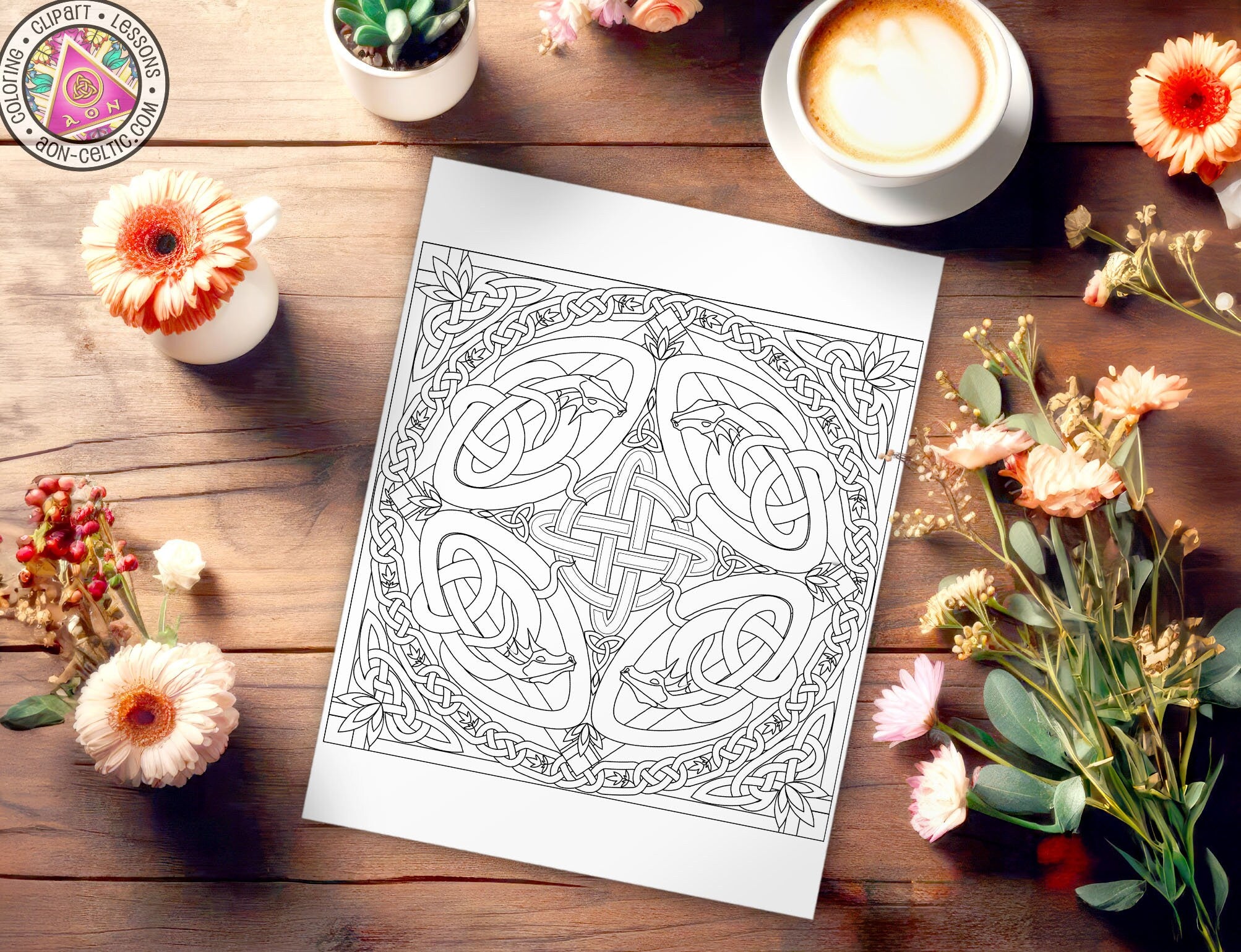 a picture of a coloring book surrounded by flowers and a cup of coffee