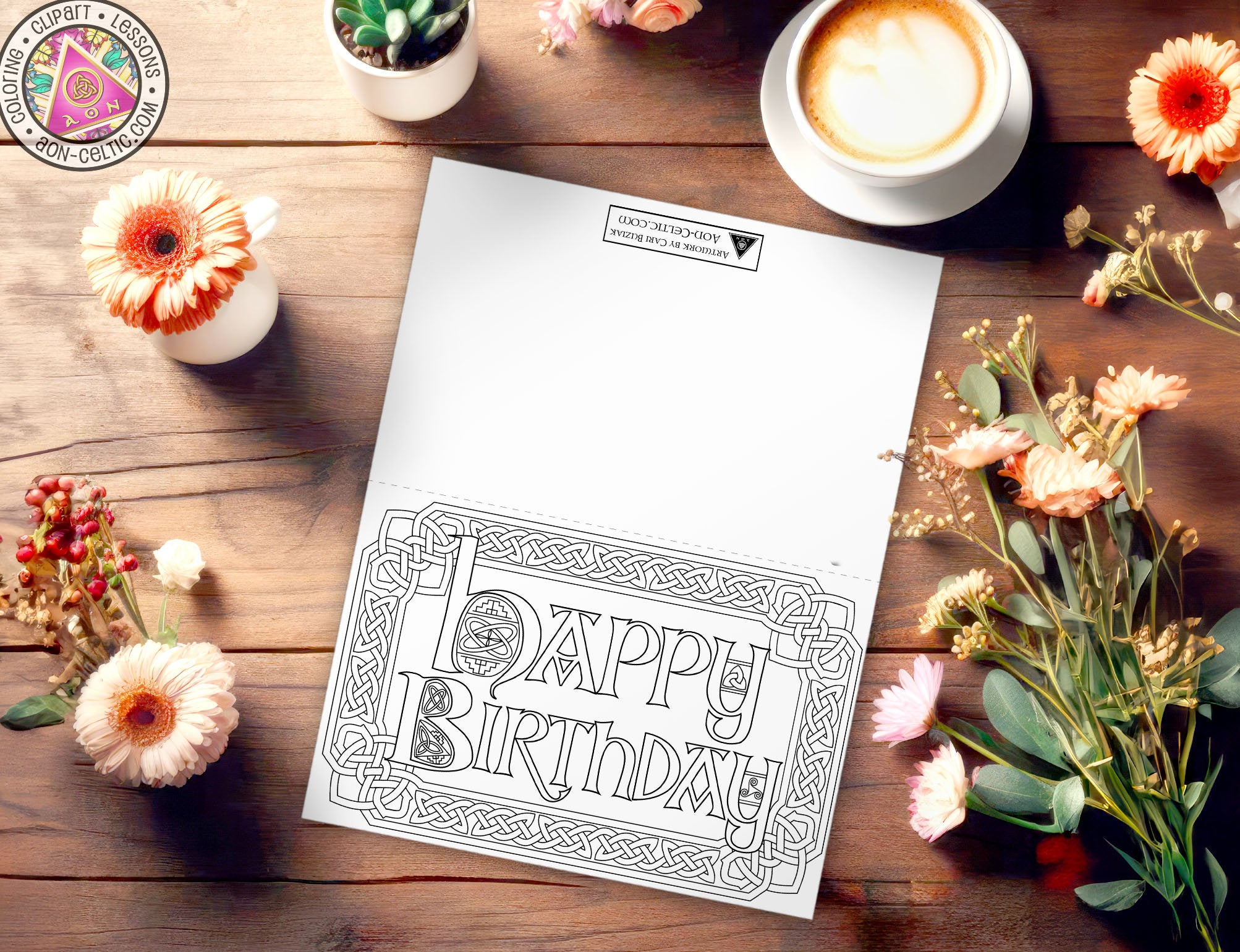 a birthday card sitting on top of a table next to flowers