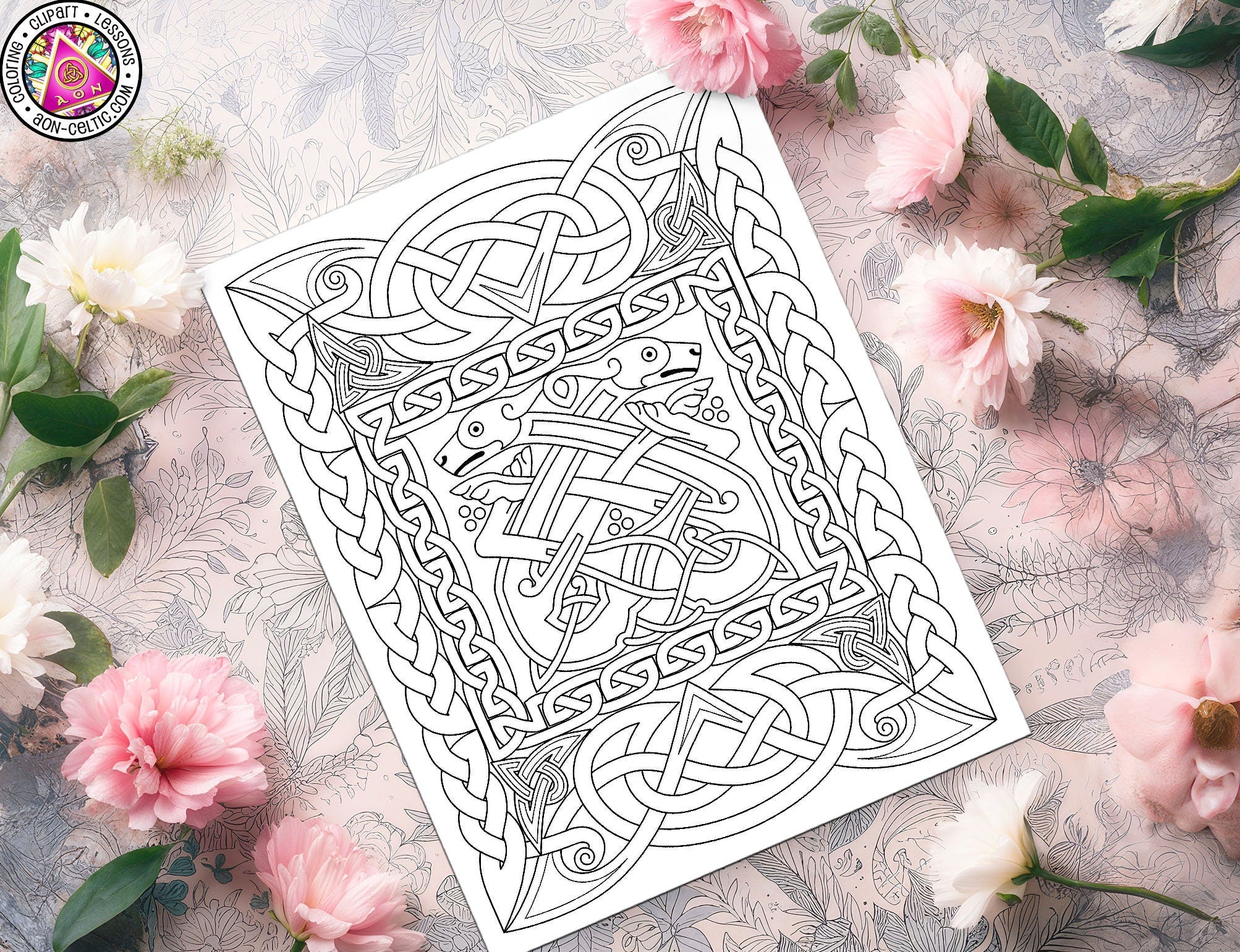 a coloring book surrounded by flowers and a cup of coffee