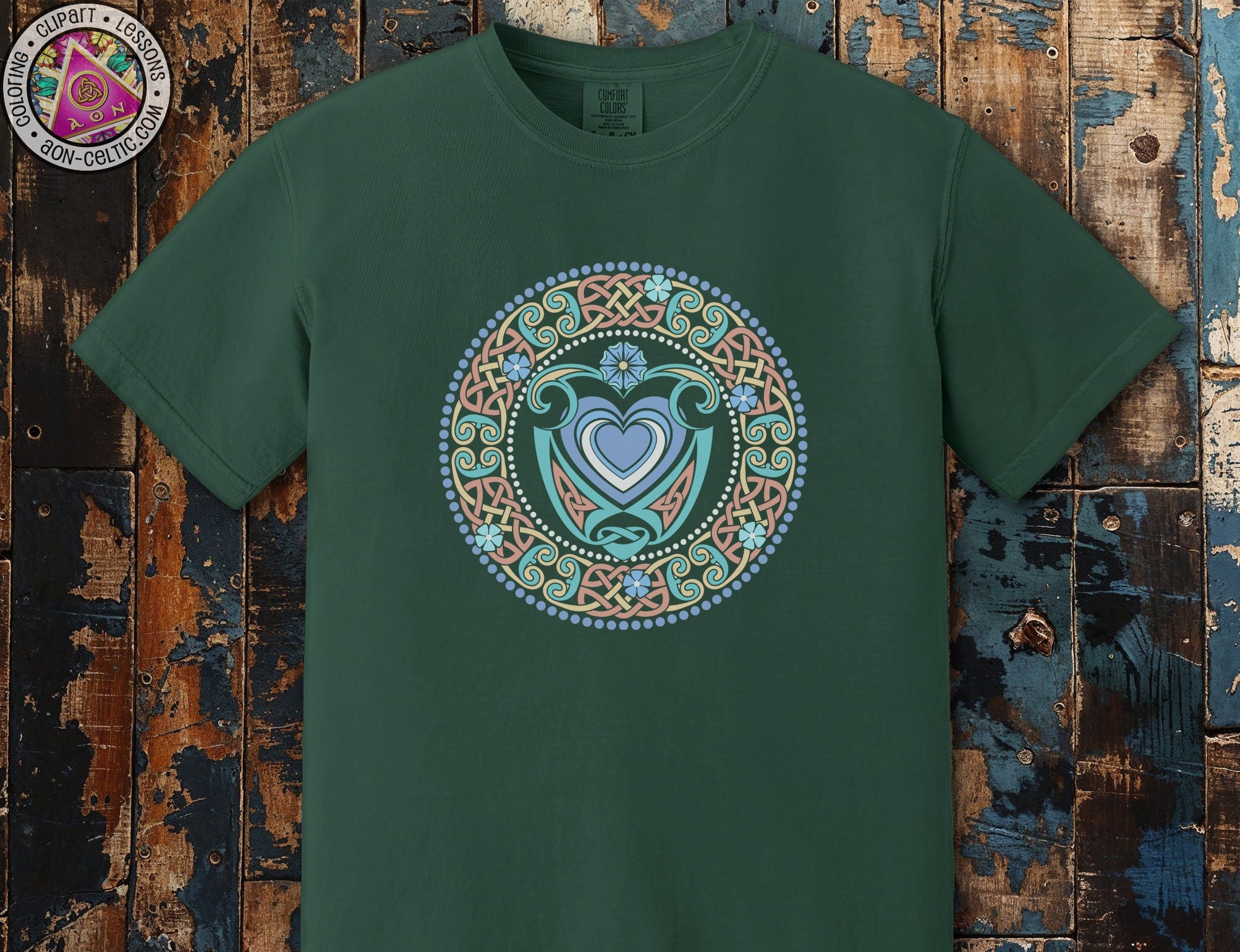 a green t - shirt with a heart in the center