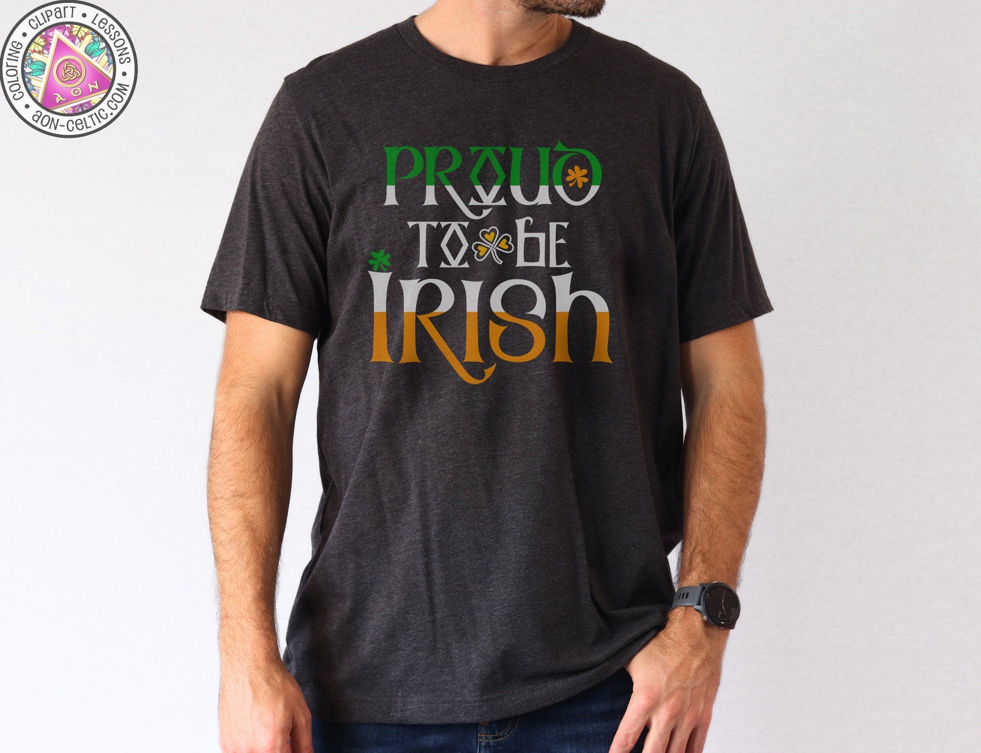 a man wearing a black t - shirt that says proud to be irish