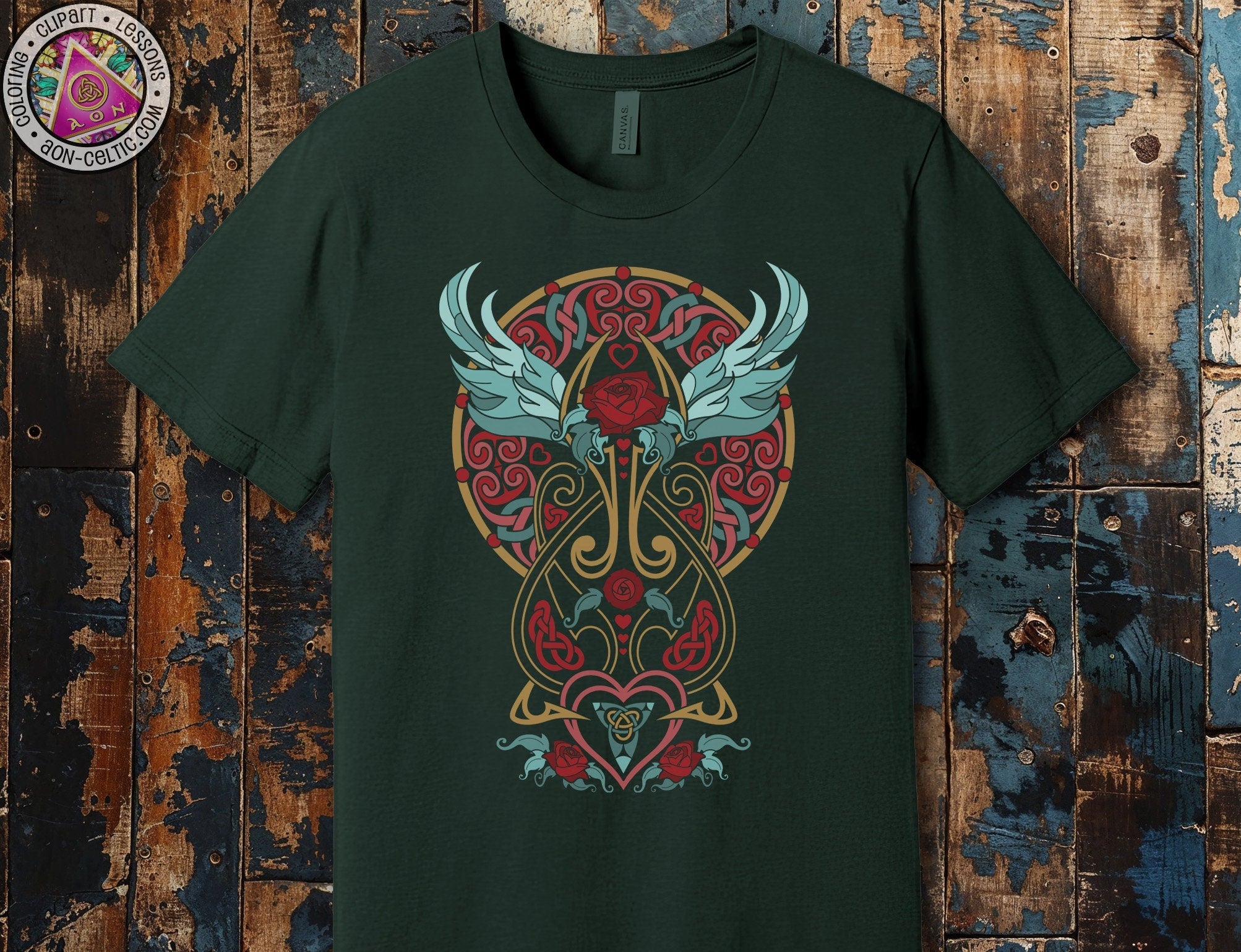 a green t - shirt with a heart and wings on it