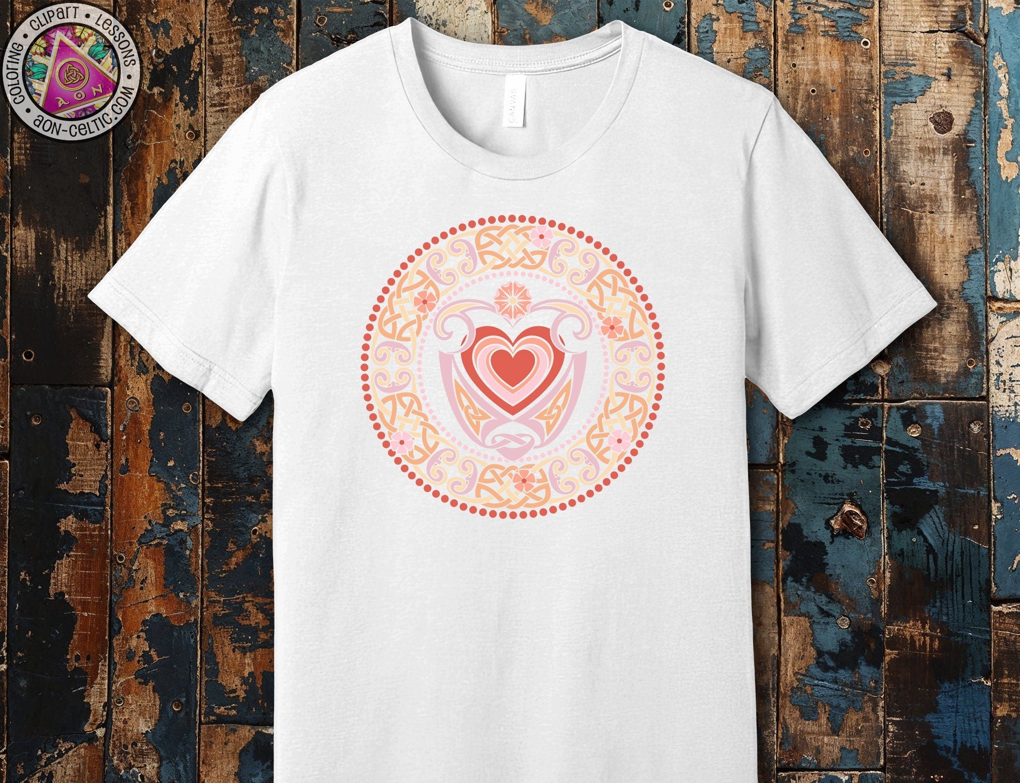 a white t - shirt with a heart in the center