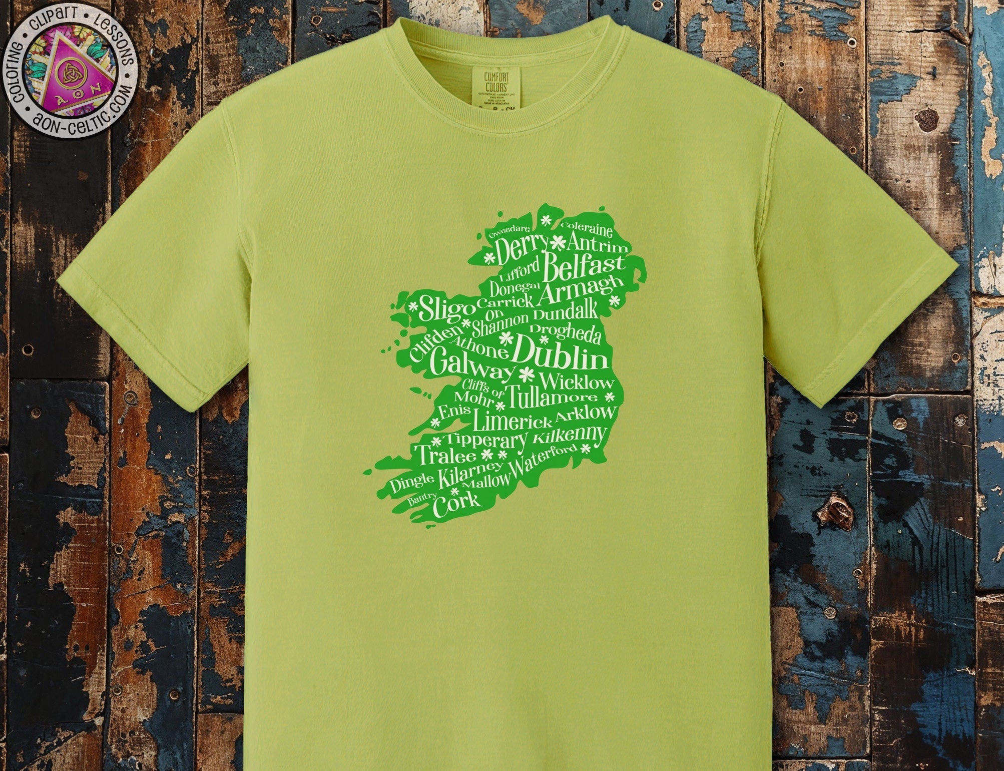 a green t - shirt with words written in different languages