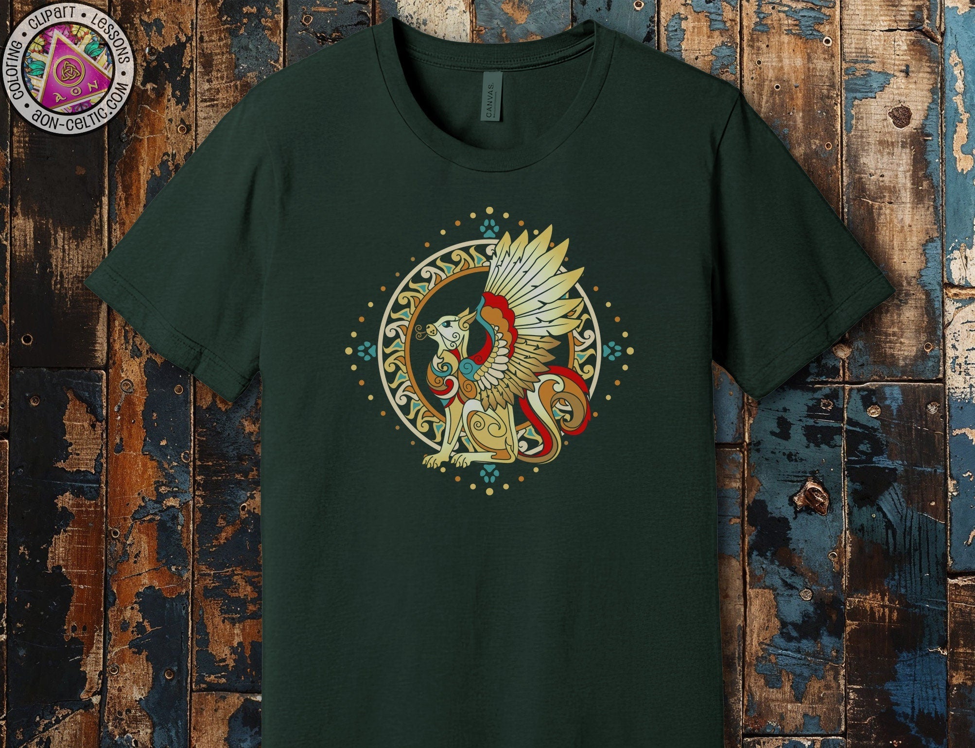 a green t - shirt with an image of a winged bird on it