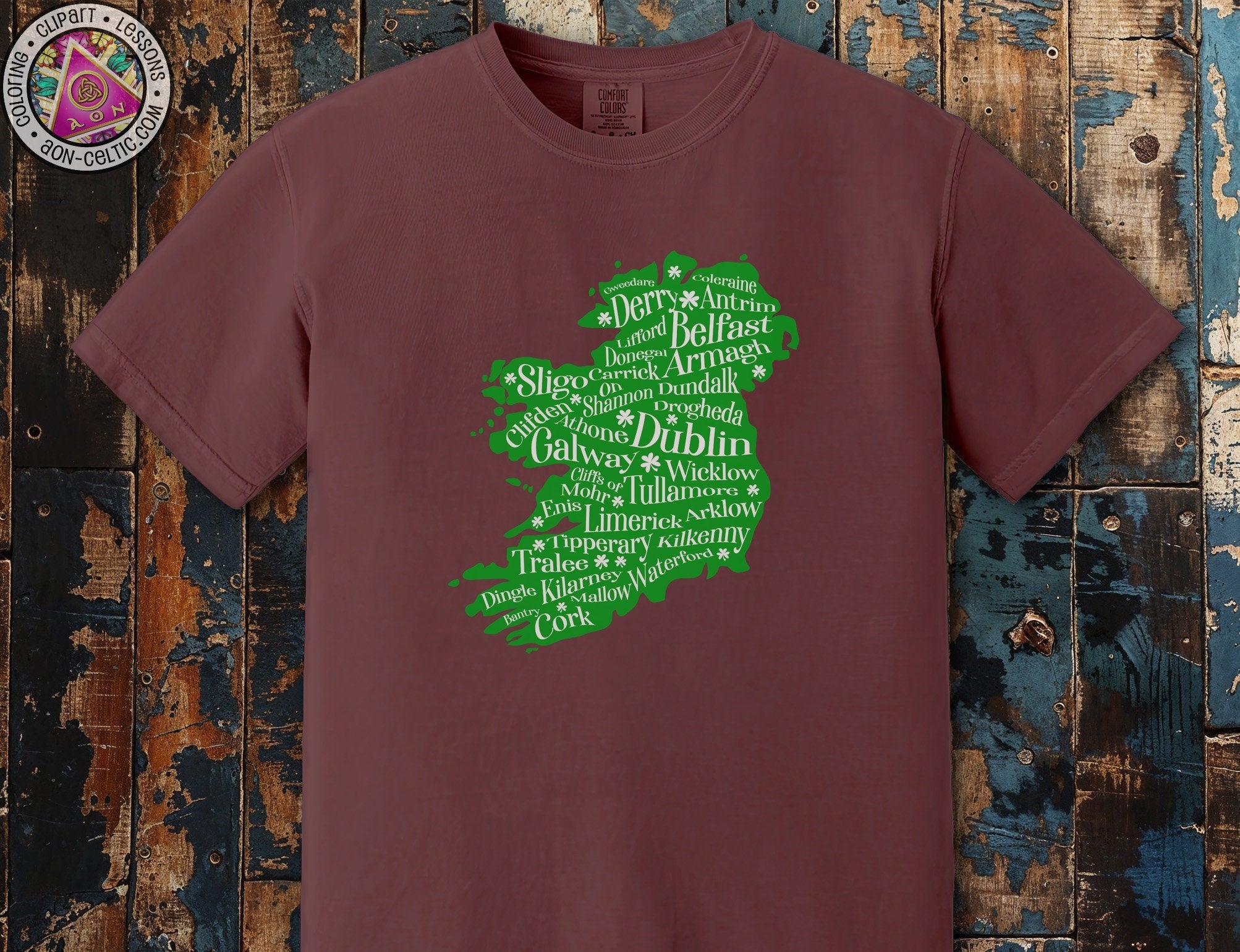 a maroon t - shirt with a green map of ireland