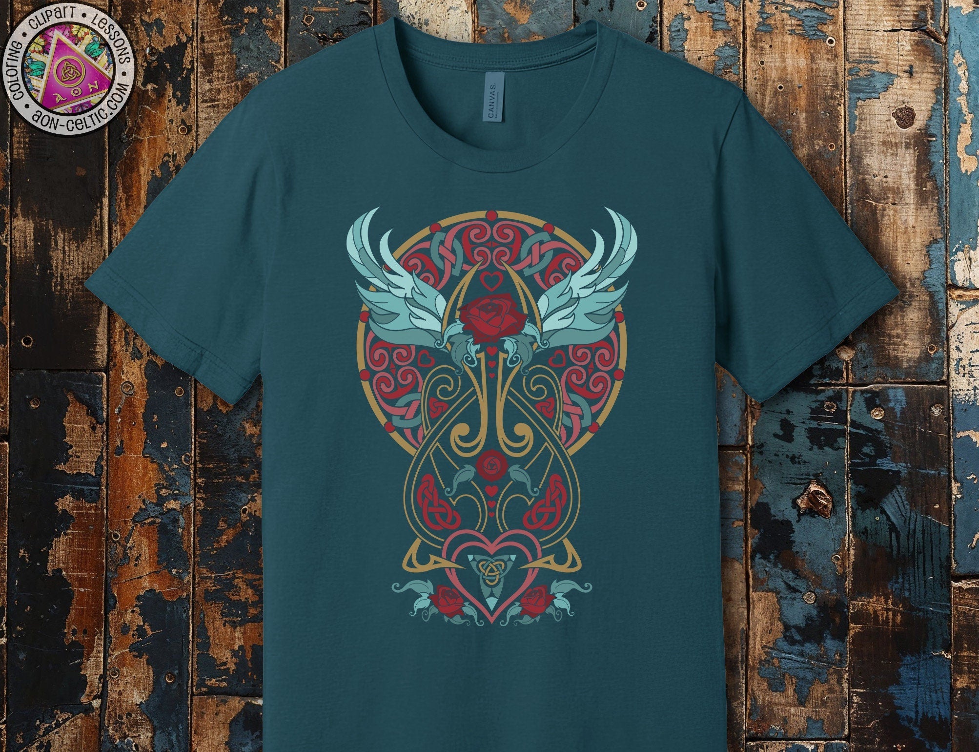 a green t - shirt with a heart and wings on it