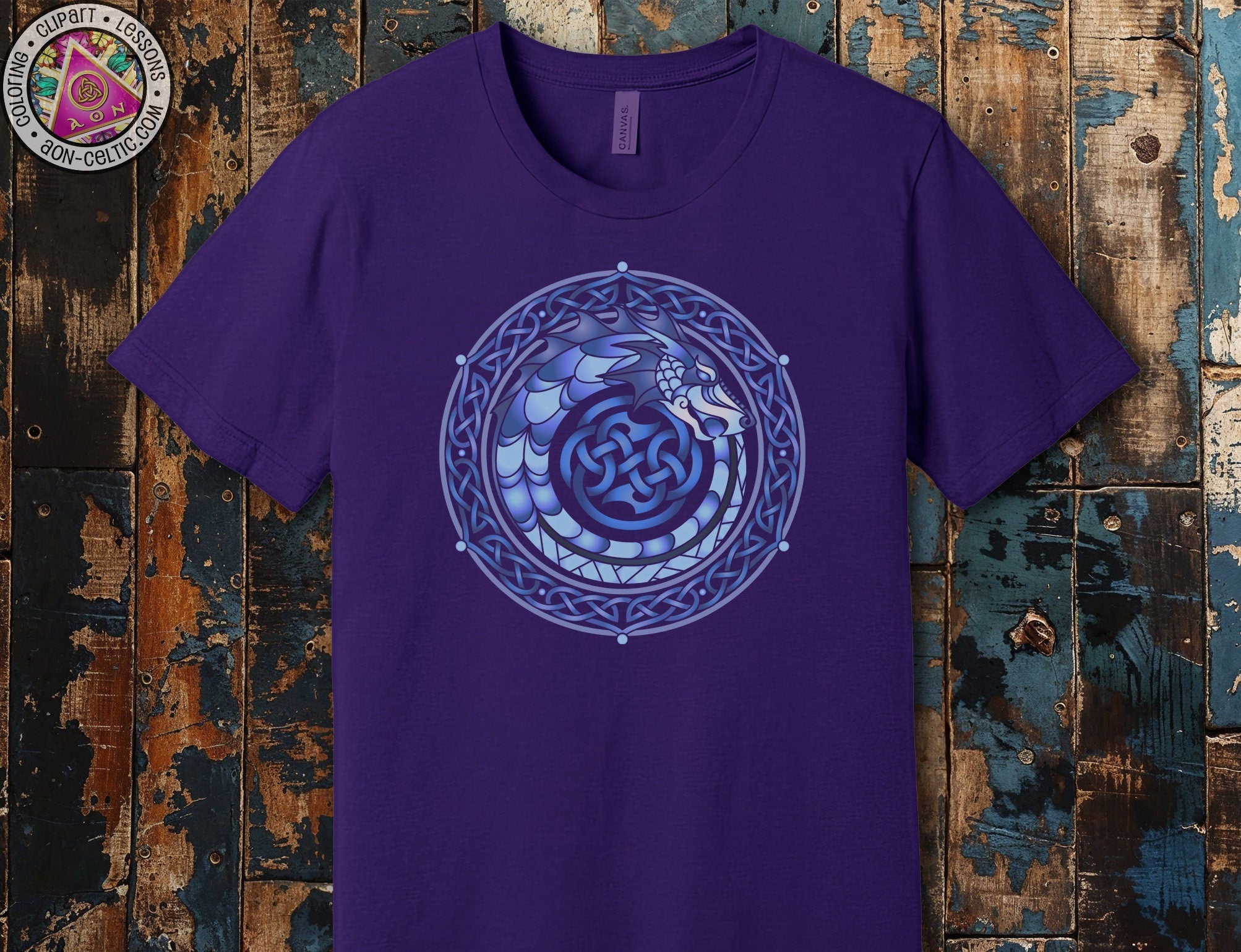 a purple t - shirt with a blue design on it